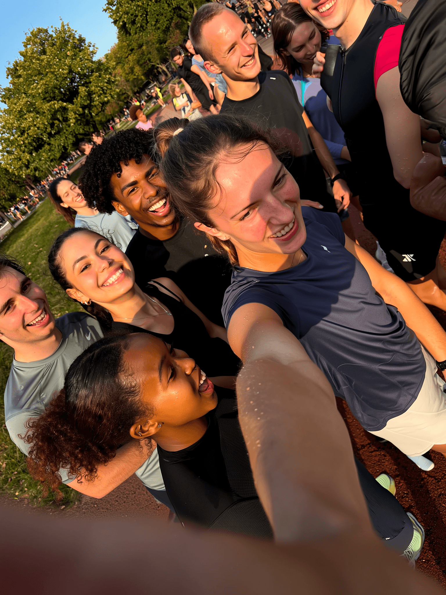 Diverse group of runners in a community setting, representing the Saffrun running community platform